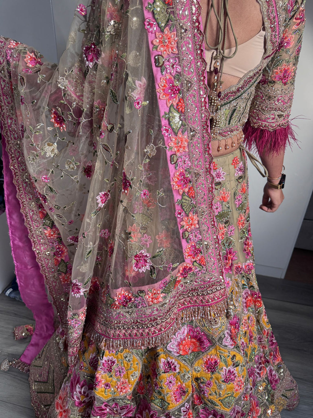 Sage green and pink lengha with very heavy embellished dupatta