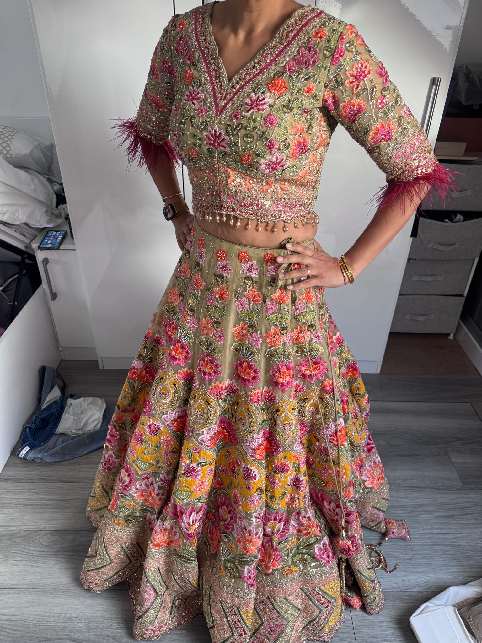 Sage green and pink lengha with very heavy embellished dupatta