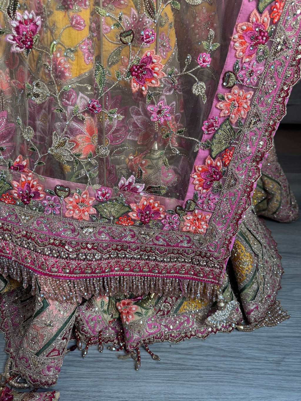 Sage green and pink lengha with very heavy embellished dupatta