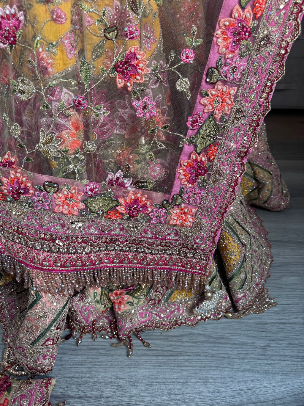 Sage green and pink lengha with very heavy embellished dupatta