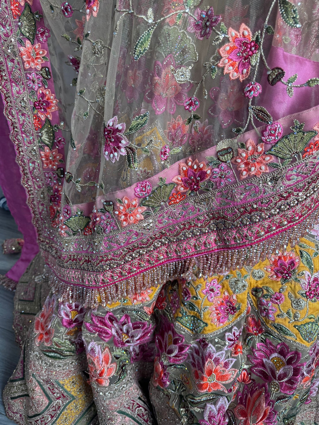 Sage green and pink lengha with very heavy embellished dupatta
