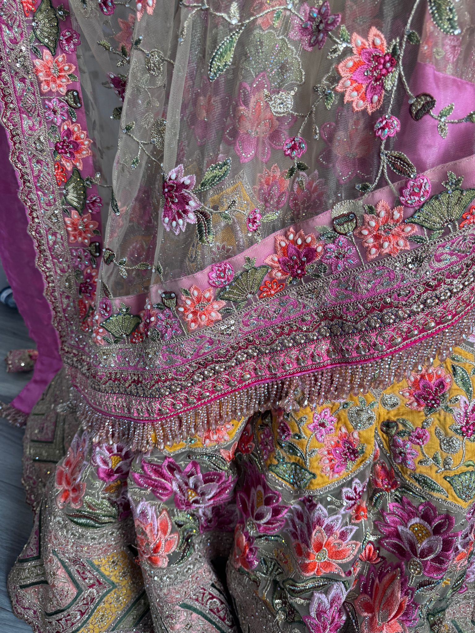 Sage green and pink lengha with very heavy embellished dupatta