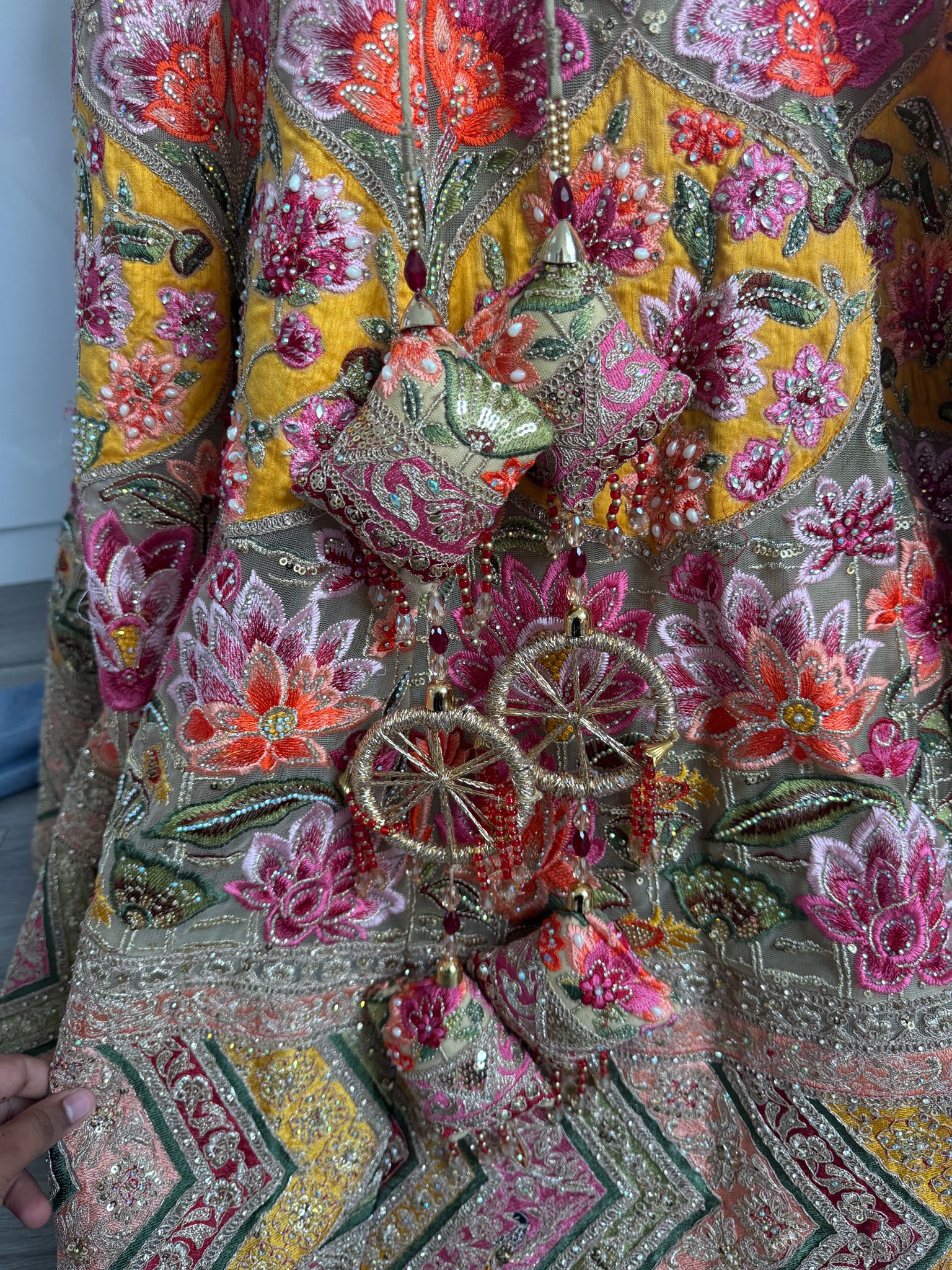 Sage green and pink lengha with very heavy embellished dupatta