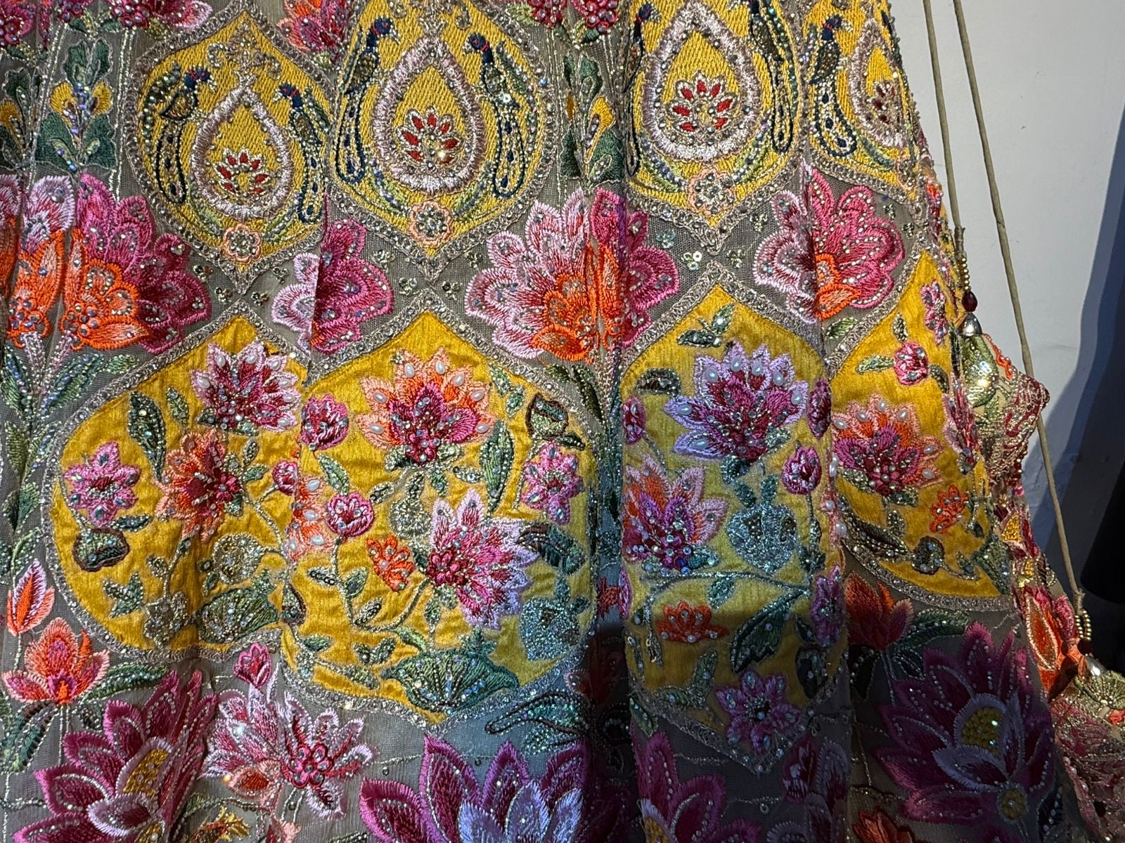 Sage green and pink lengha with very heavy embellished dupatta
