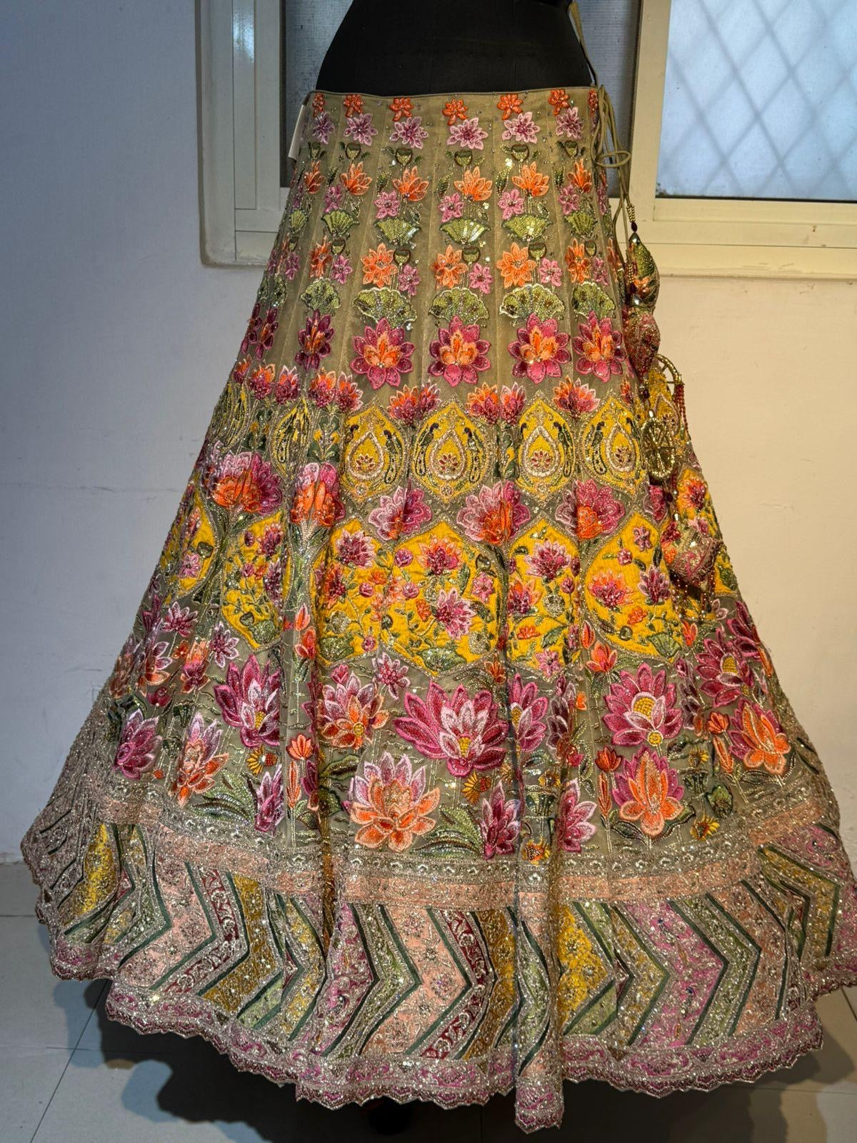 Sage green and pink lengha with very heavy embellished dupatta