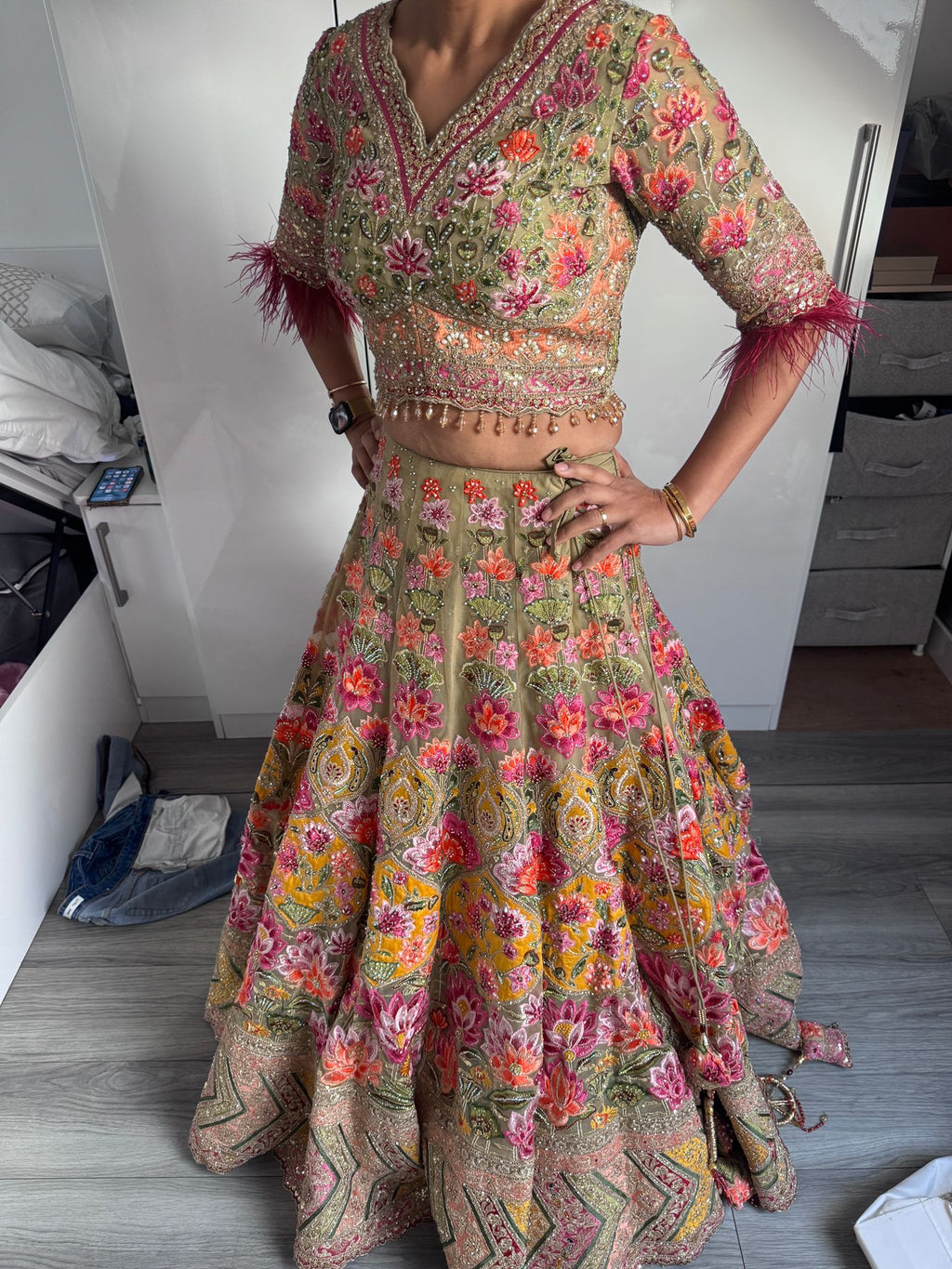 Sage green and pink lengha with very heavy embellished dupatta