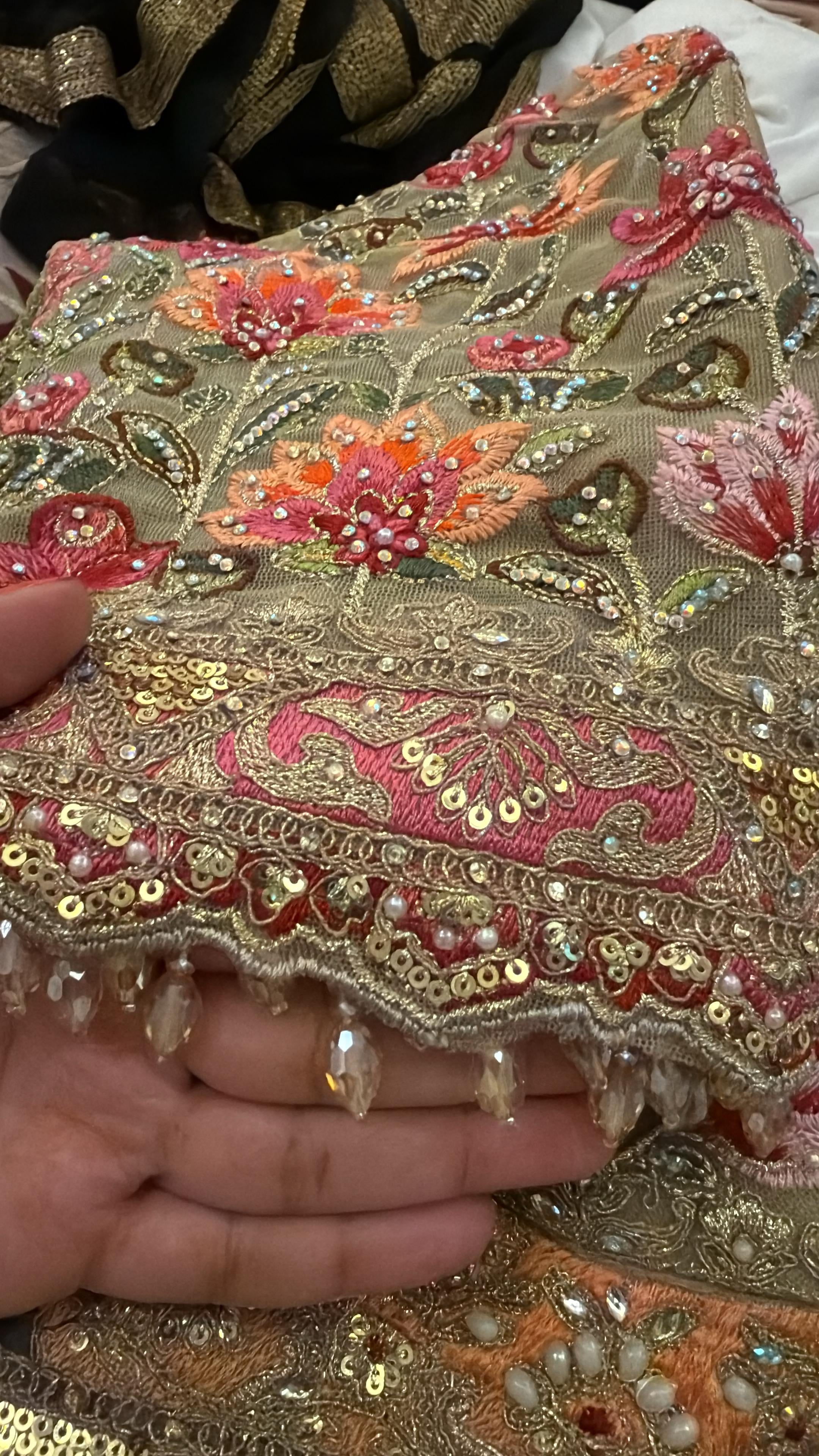 Sage green and pink lengha with very heavy embellished dupatta