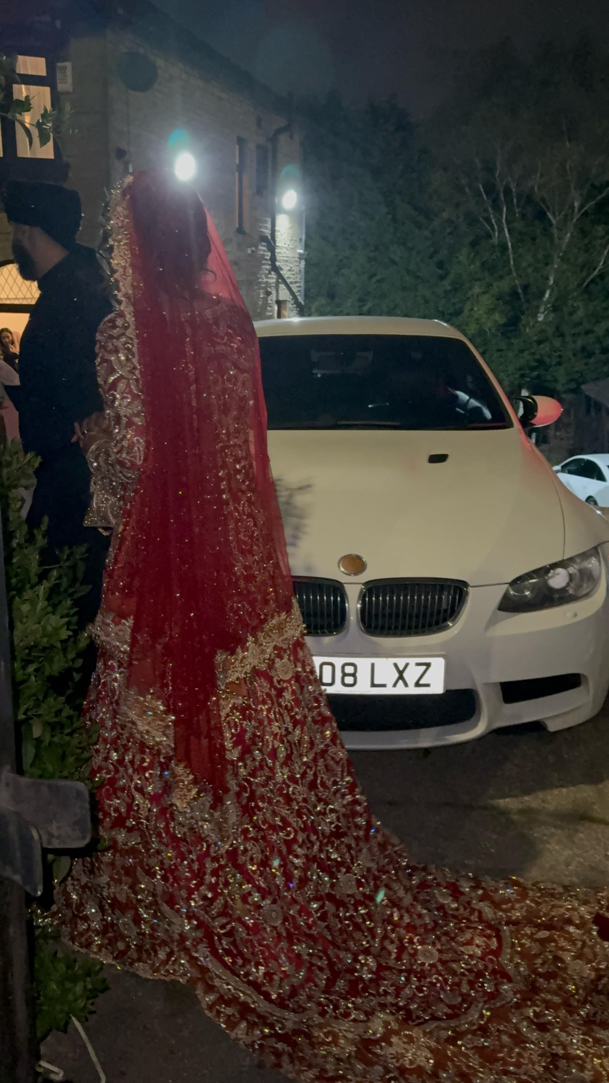 Red and orange bridal dress with gold detailing