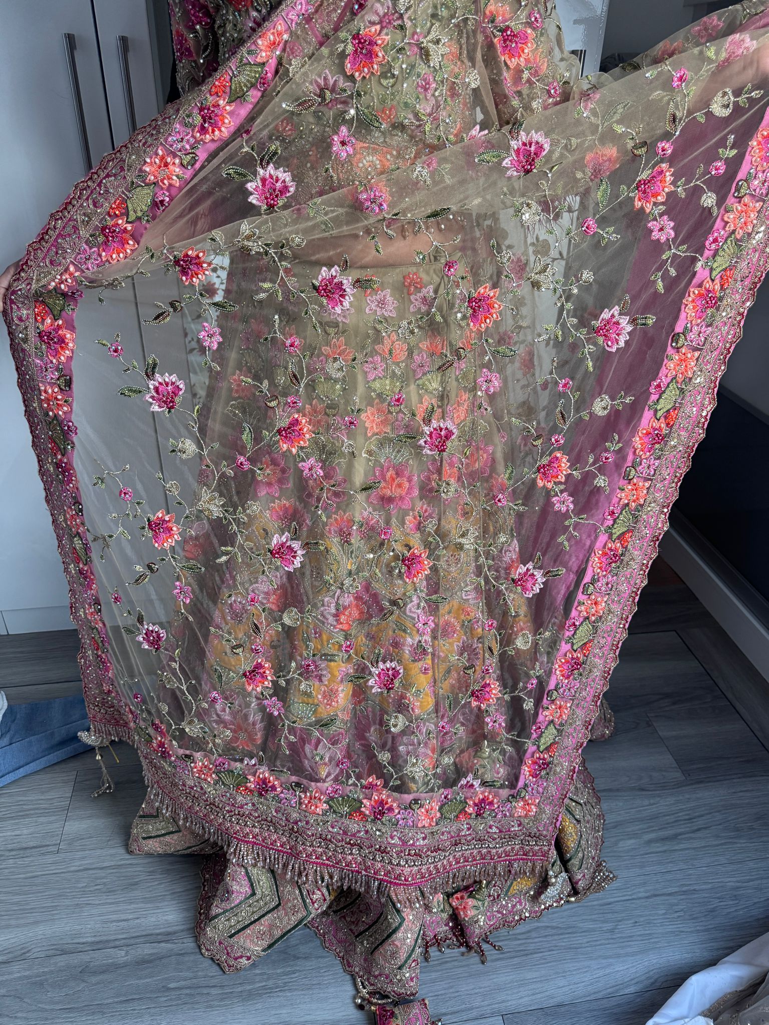 Sage green and pink lengha with very heavy embellished dupatta