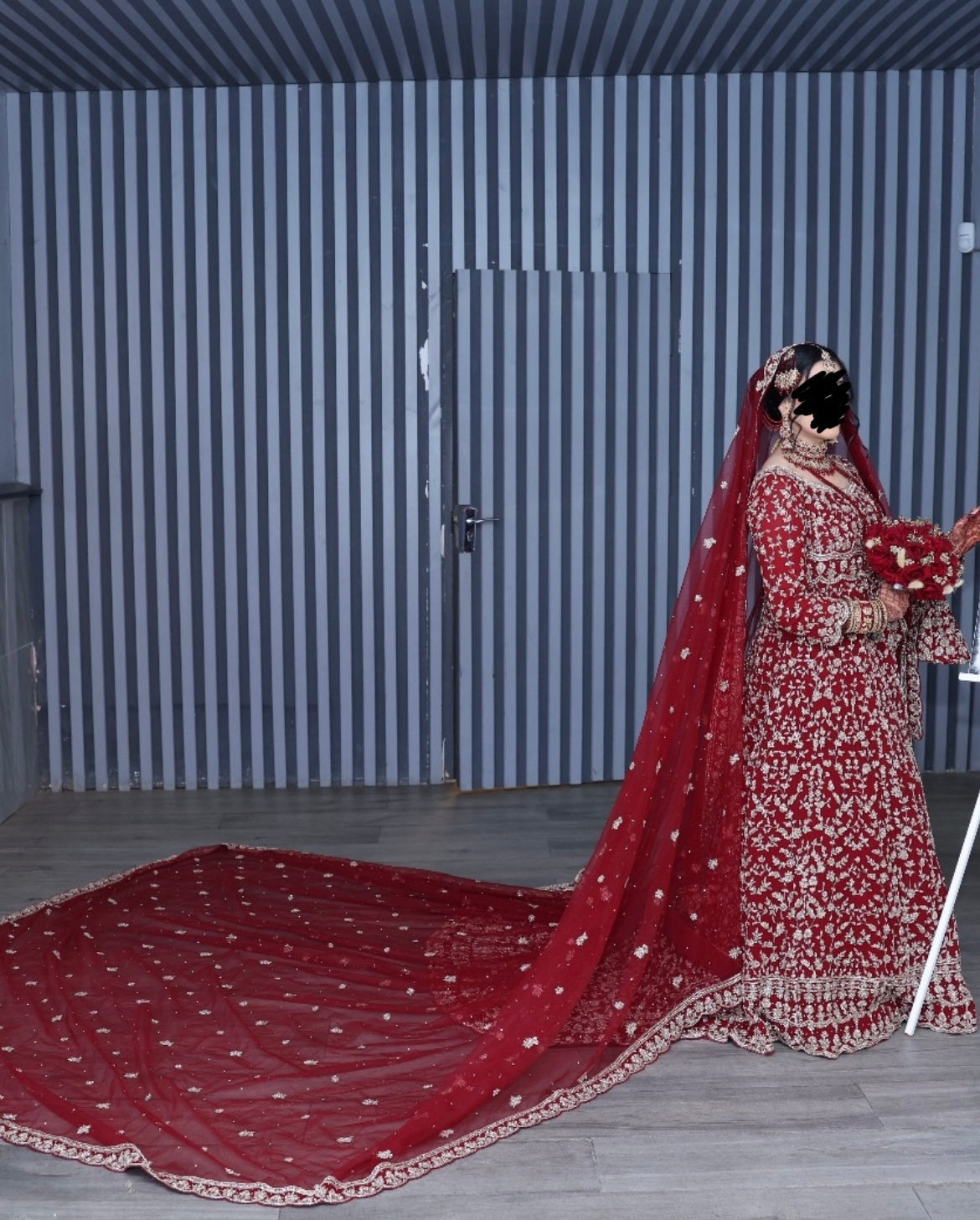 Heavy fully embroidered red Lengha with long veil