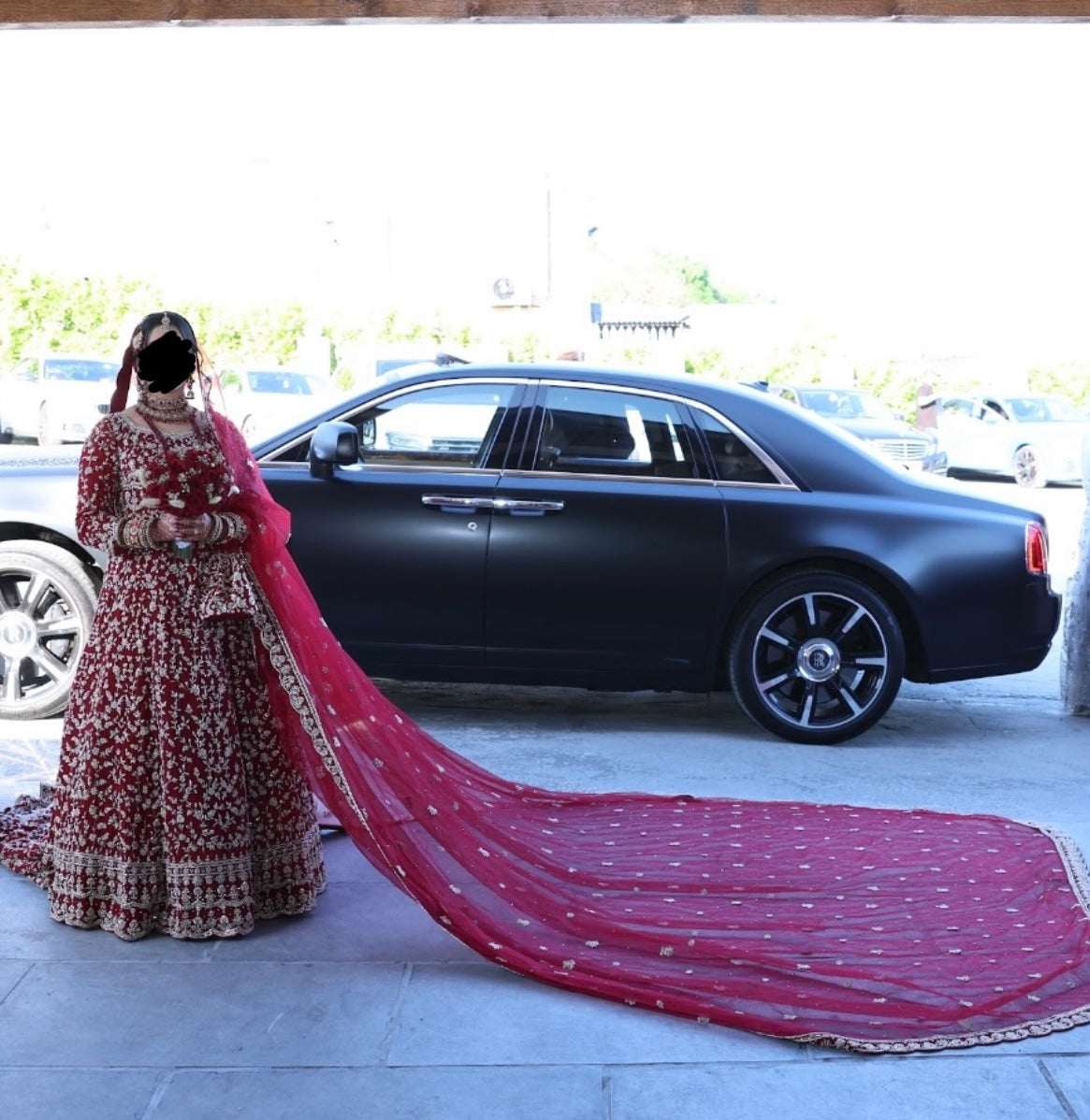 Heavy fully embroidered red Lengha with long veil